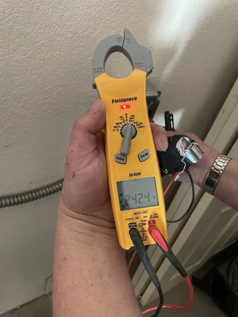 Voltage testing with clamp meter during Electrical Installation Services in Erie